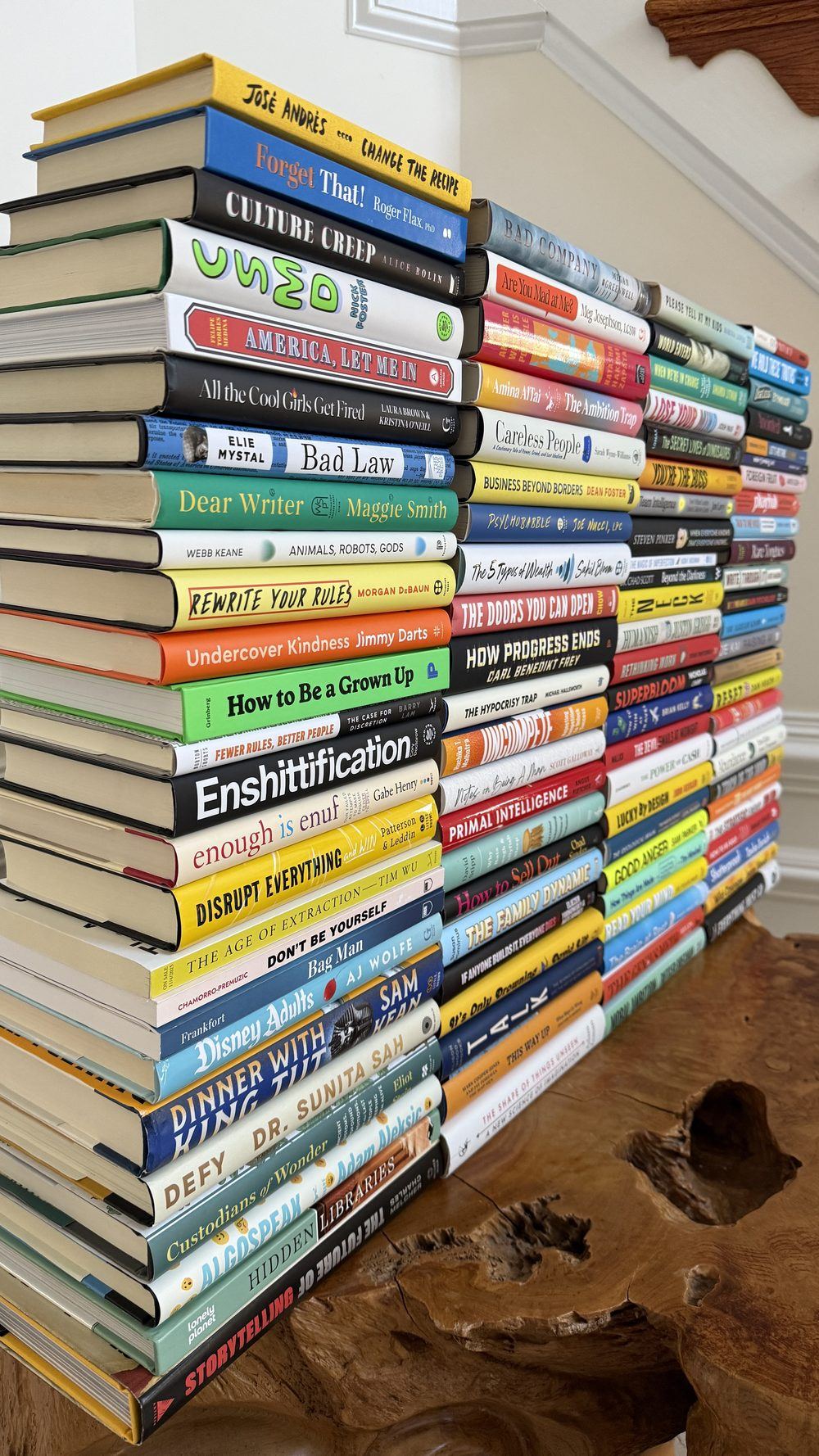 Stacks of longlisted books from the Non-Obvious Book Awards