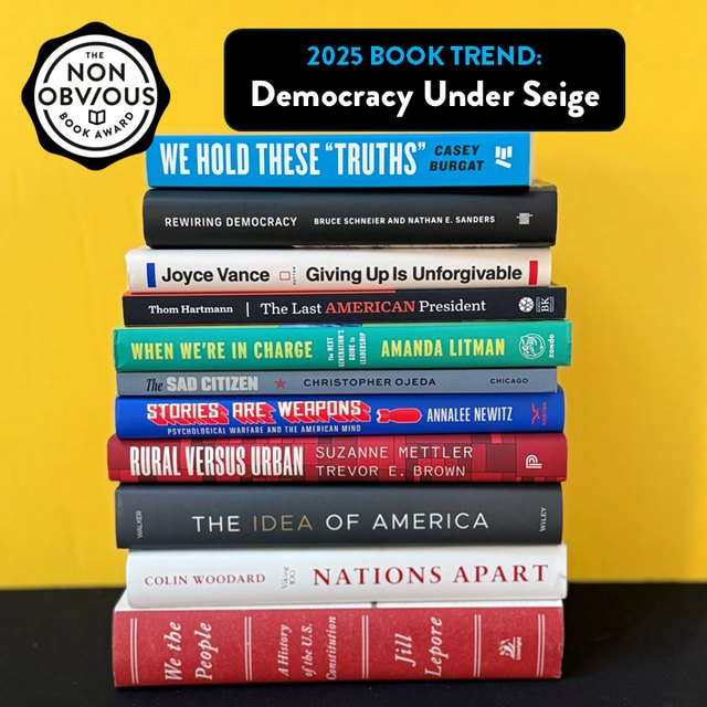 The books behind the Democracy Under Siege trend — a stack of 2025 longlist titles